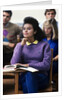 1980s college classroom students sitting at desks by Anonymous