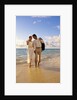 1980s 1990s couple walking on beach by Anonymous