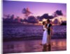 Dressed up couple embracing on the beach at sunset by Anonymous