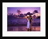 Dressed up couple embracing on the beach at sunset by Anonymous