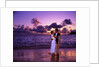 Dressed up couple embracing on the beach at sunset by Anonymous