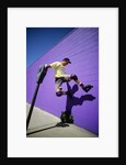 Boy Wearing Roller Blades Jumping Against Wall by Anonymous