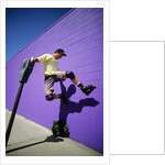 Boy Wearing Roller Blades Jumping Against Wall by Anonymous