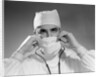 1960s male doctor wearing surgical mask and operating room scrubs by Anonymous