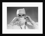 1960s male doctor wearing surgical mask and operating room scrubs by Anonymous