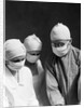 1920s 1930s doctor and two nurses wearing surgical masks by Anonymous