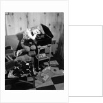 1950s teenage girl listening to music on a phonograph by Anonymous