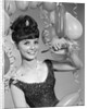 1960s smiling young woman at New Year party by Anonymous