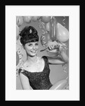1960s smiling young woman at New Year party by Anonymous