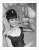 1960s smiling young woman at New Year party by Anonymous
