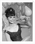 1960s smiling young woman at New Year party by Anonymous