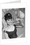 1960s smiling young woman at New Year party by Anonymous