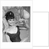 1960s smiling young woman at New Year party by Anonymous