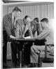1950s group of businessmen looking at a blueprint on a table by Anonymous