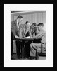 1950s group of businessmen looking at a blueprint on a table by Anonymous