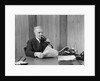 1930s senior executive speaking into a dictaphone by Anonymous