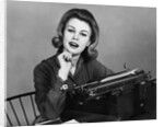 1960s smiling secretary with a typewriter by Anonymous