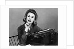 1960s smiling secretary with a typewriter by Anonymous
