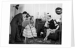 1940s photographer taking picture of young people at New Years party by Anonymous