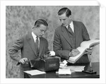 1920s bookkeeper and young assistant by Anonymous