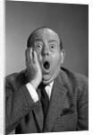 1960s balding man with a shocked expression by Anonymous