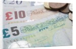 Paper money with change on a table by Anonymous