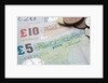 Paper money with change on a table by Anonymous