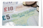 Paper money with change on a table by Anonymous