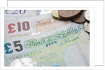 Paper money with change on a table by Anonymous