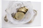 Looking down into an open money bag of pound coins by Anonymous