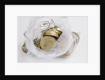 Looking down into an open money bag of pound coins by Anonymous