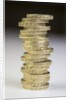 A pile of pound coins on a table by Anonymous