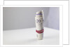 A roll of twenty pound notes on a table by Anonymous