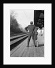 1950s 1960s man waiting for a train by Anonymous