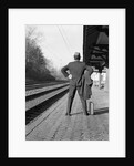 1950s 1960s man waiting for a train by Anonymous