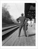 1950s 1960s man waiting for a train by Anonymous