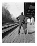 1950s 1960s man waiting for a train by Anonymous