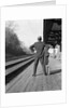 1950s 1960s man waiting for a train by Anonymous