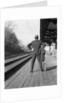 1950s 1960s man waiting for a train by Anonymous