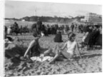 1920s two women sitting on the beach in bathing suits by Anonymous