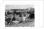 1920s two women sitting on the beach in bathing suits by Anonymous