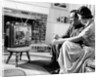 1950s couple watching television by Anonymous