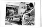 1950s couple watching television by Anonymous