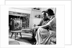 1950s couple watching television by Anonymous