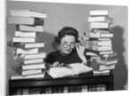 1950s portrait of woman sitting with stacks of books by Anonymous