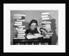 1950s portrait of woman sitting with stacks of books by Anonymous