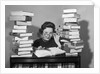 1950s portrait of woman sitting with stacks of books by Anonymous