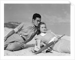 1930s couple lying on a beach by Anonymous