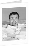 1960s portrait of bug-eyed man buried by bills by Anonymous