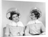 1960s two women sitting under hairdryers gossiping by Anonymous